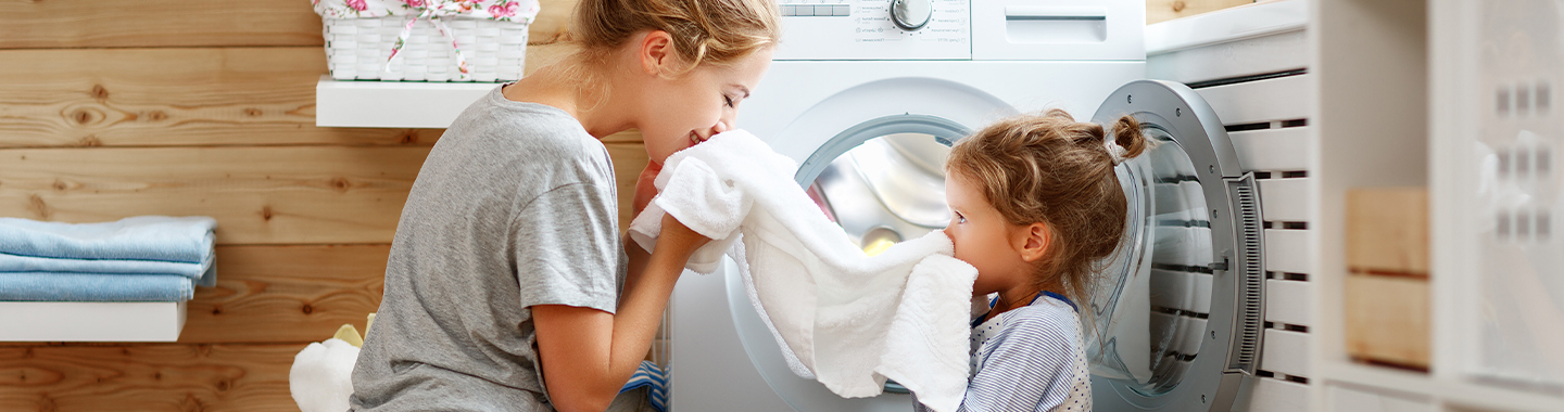 Two kids doing laundry